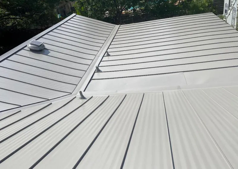 Solar attic fan installed on a metal roof for Roof Ventilation in Hidden Valley Lake