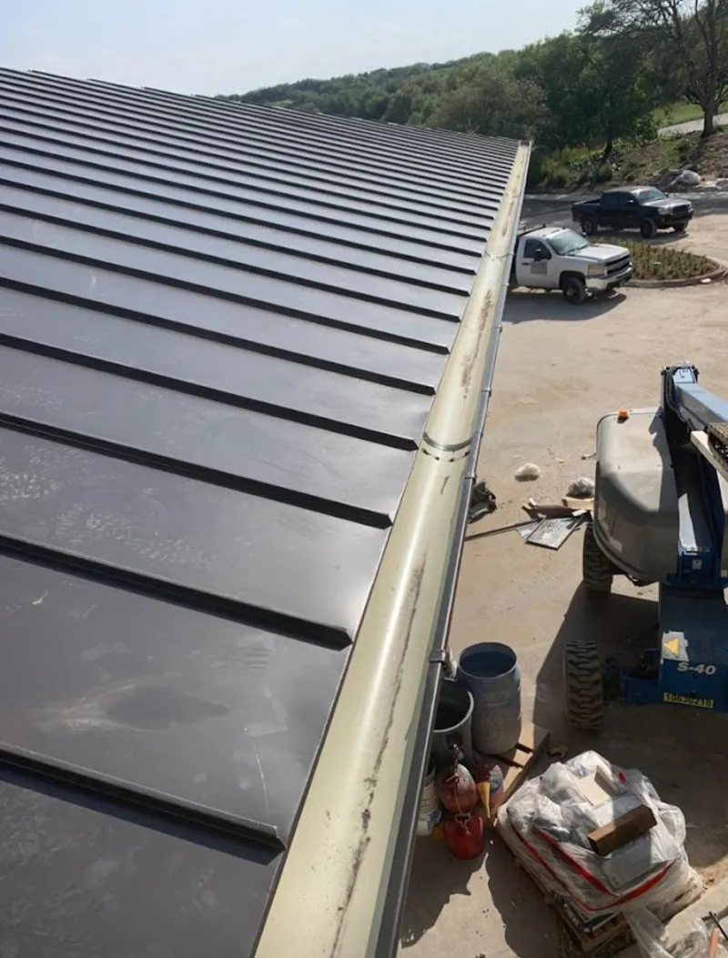 Standing seam panel and gutter detail on a metal roofing jobsite in Hidden Valley Lake